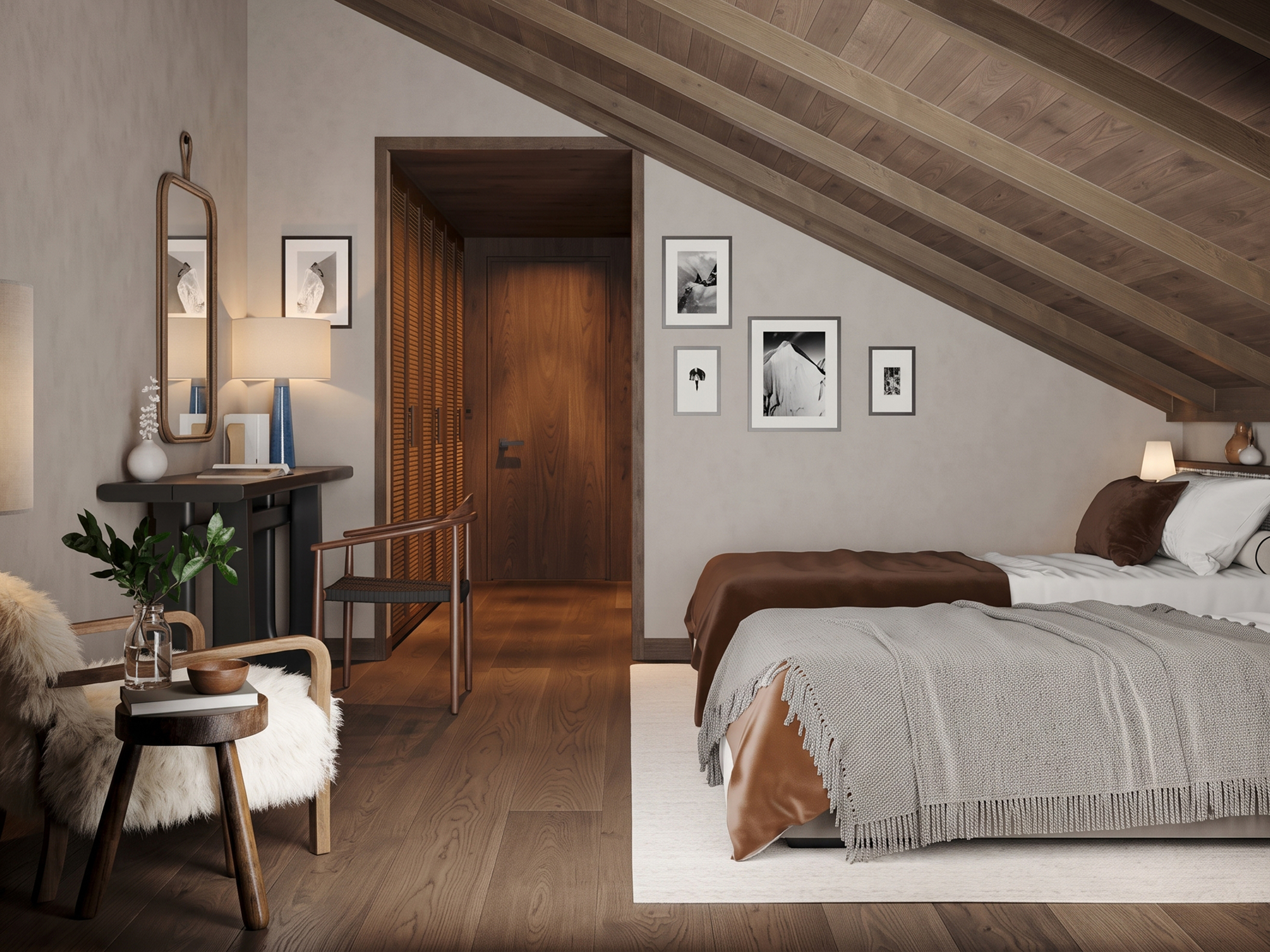 Bedroom under a sloped ceiling, with a console table, mirror and framed photographs.