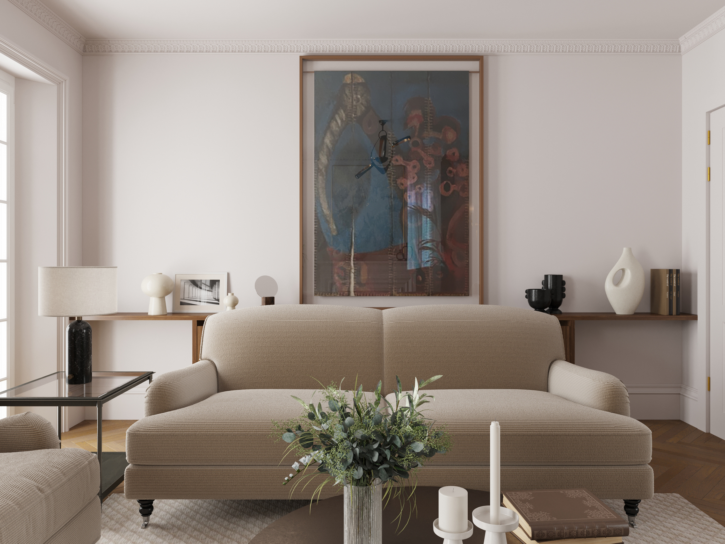 Living room with a pale sofa beneath a large portrait, and flowers on the table.