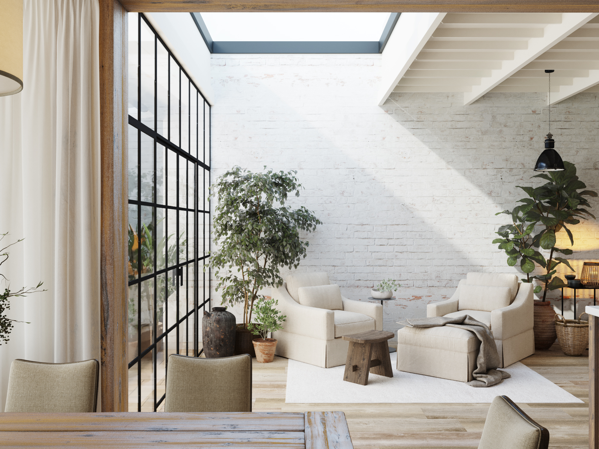 Garden room with steel-framed glazing and a skylight, against whitewashed brick.