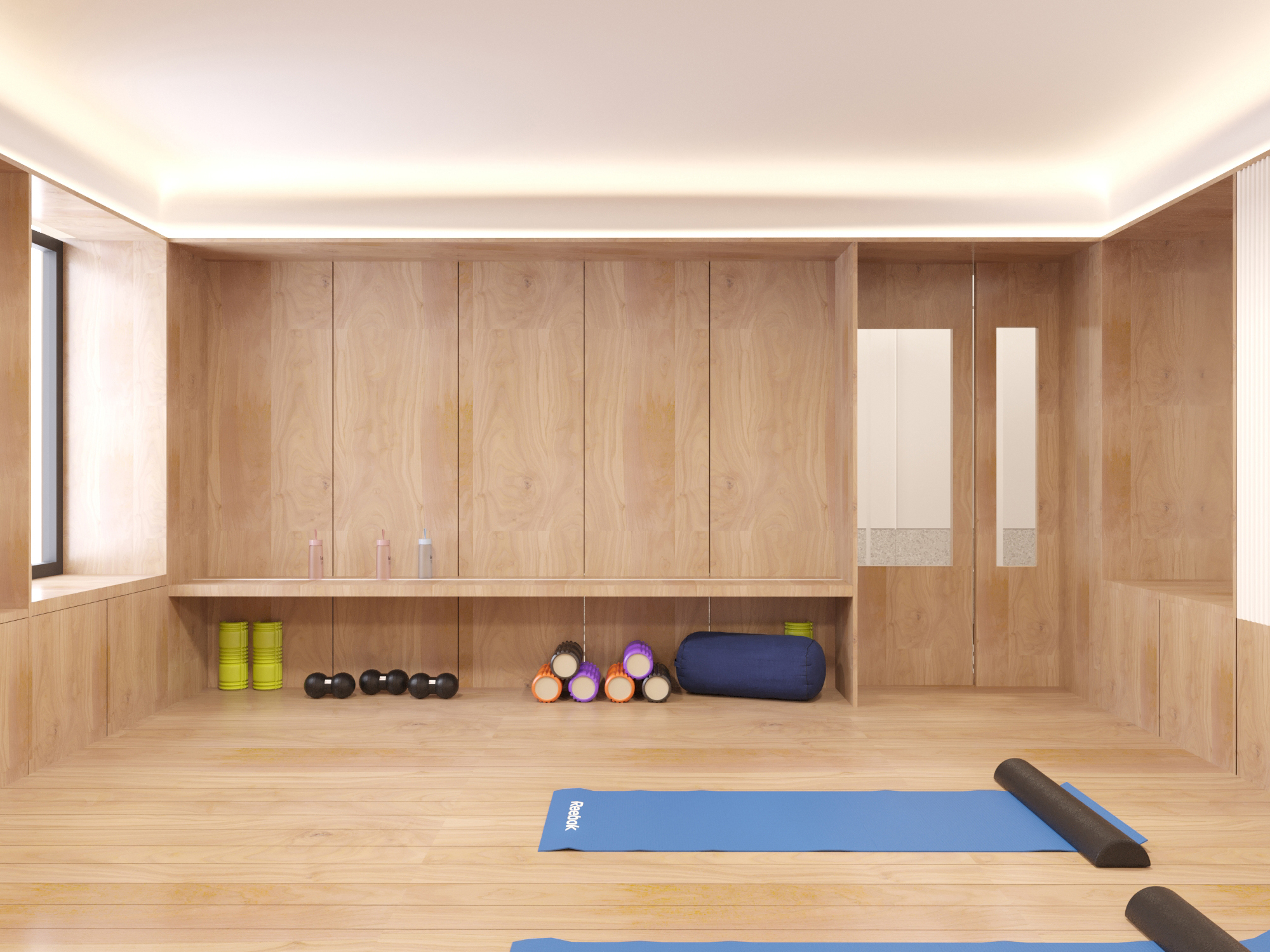 Gym lined in timber, with wall bars, mats, dumbbells and a foam roller.