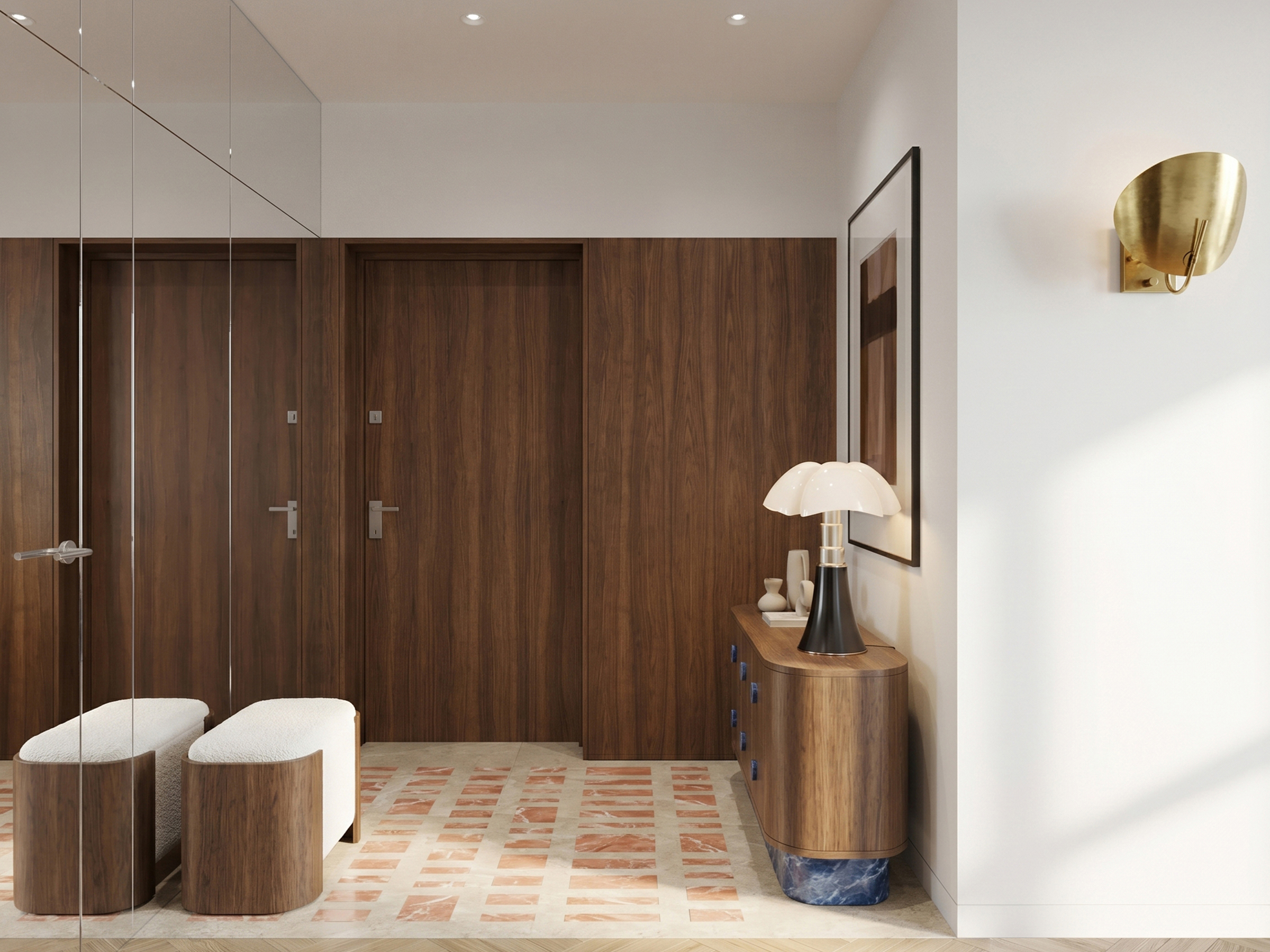 Dressing hallway with full-height walnut wardrobes, two round upholstered stools and a curved console beneath a brass wall light.