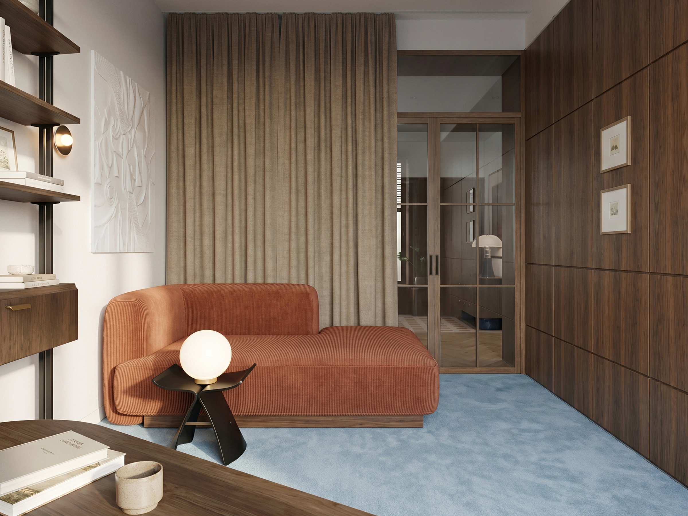 Second home office with a rust-coloured chaise longue beside open black shelving and a globe lamp on a low dark table.