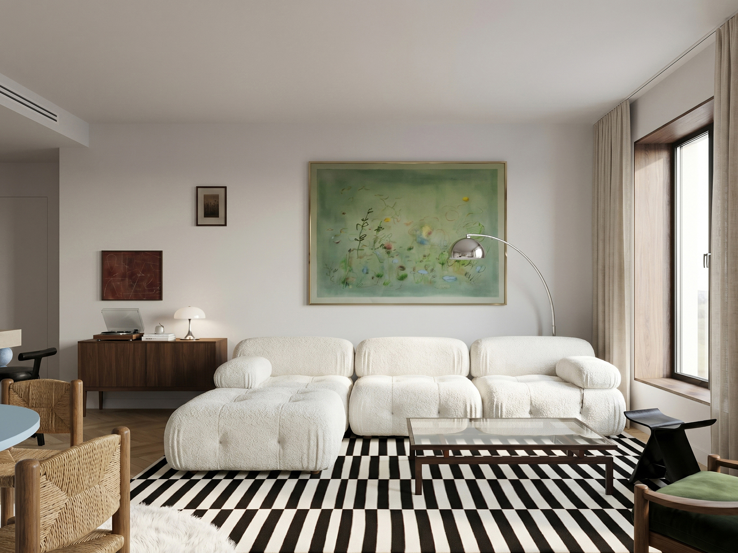 Living room seen towards the window, with the boucle sofa, striped rug and an arc floor lamp.