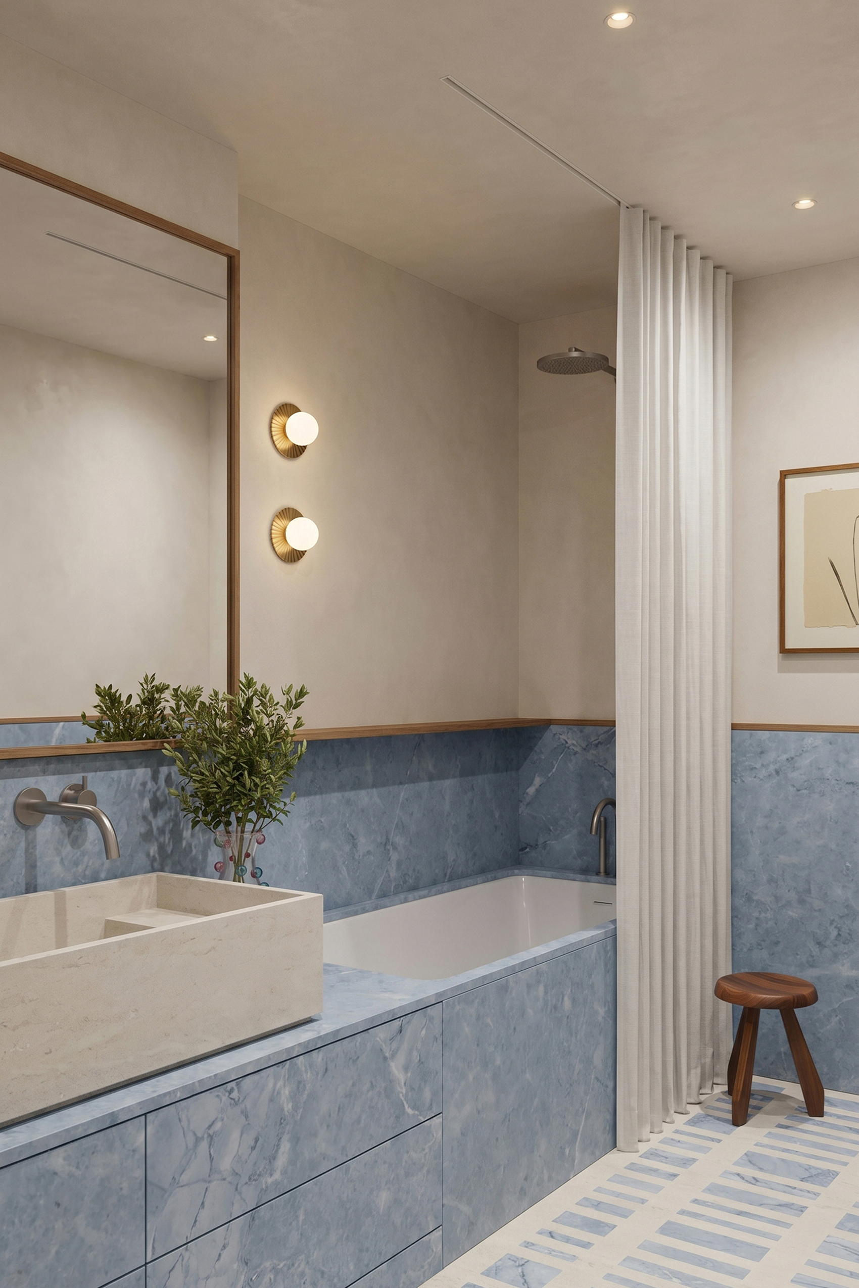 Bathroom with a blue-grey marble bath surround, wall-mounted taps and a shower area beyond.