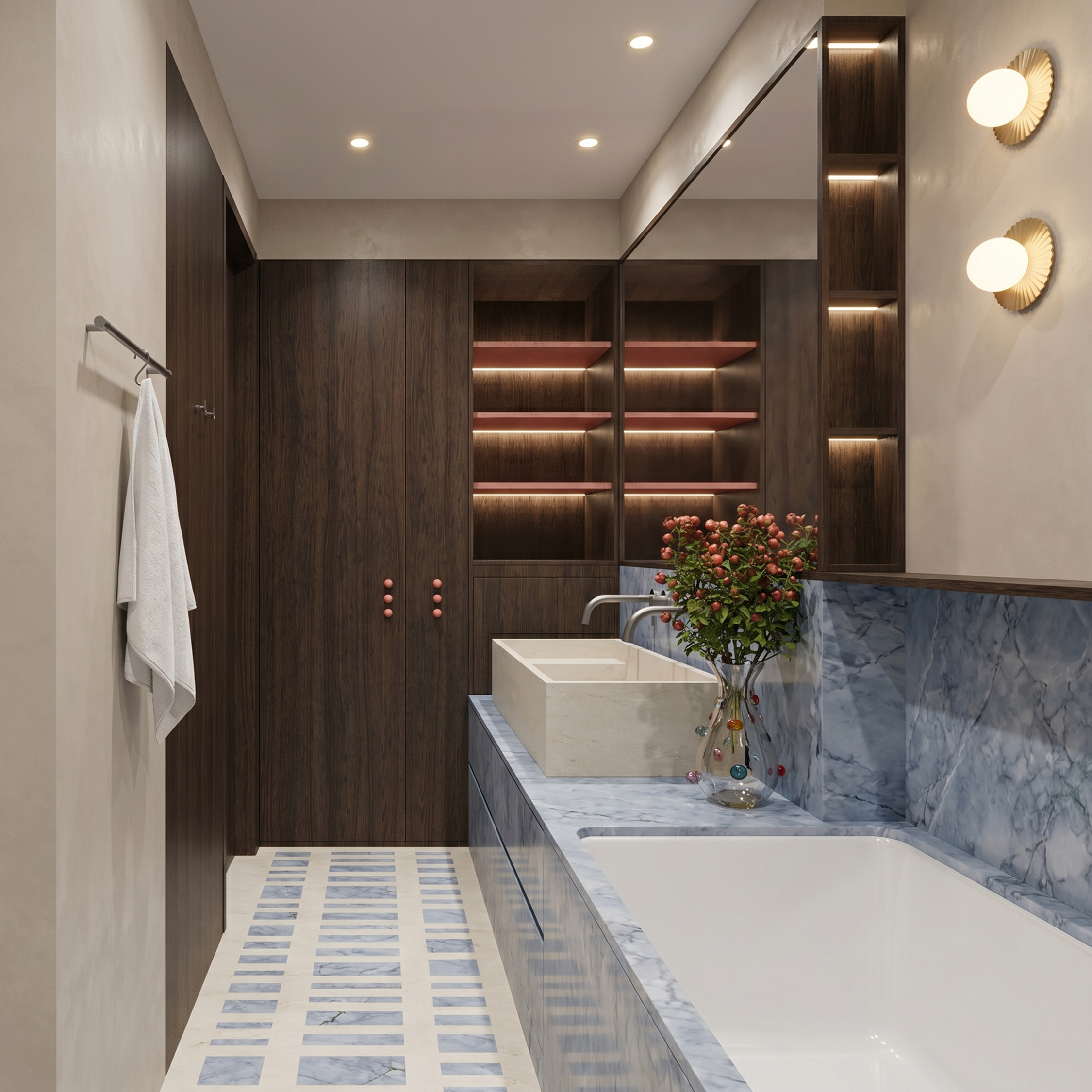 Bathroom with a stone basin and blue-grey marble bath against dark joinery with lit niches, over striped floor tiles.