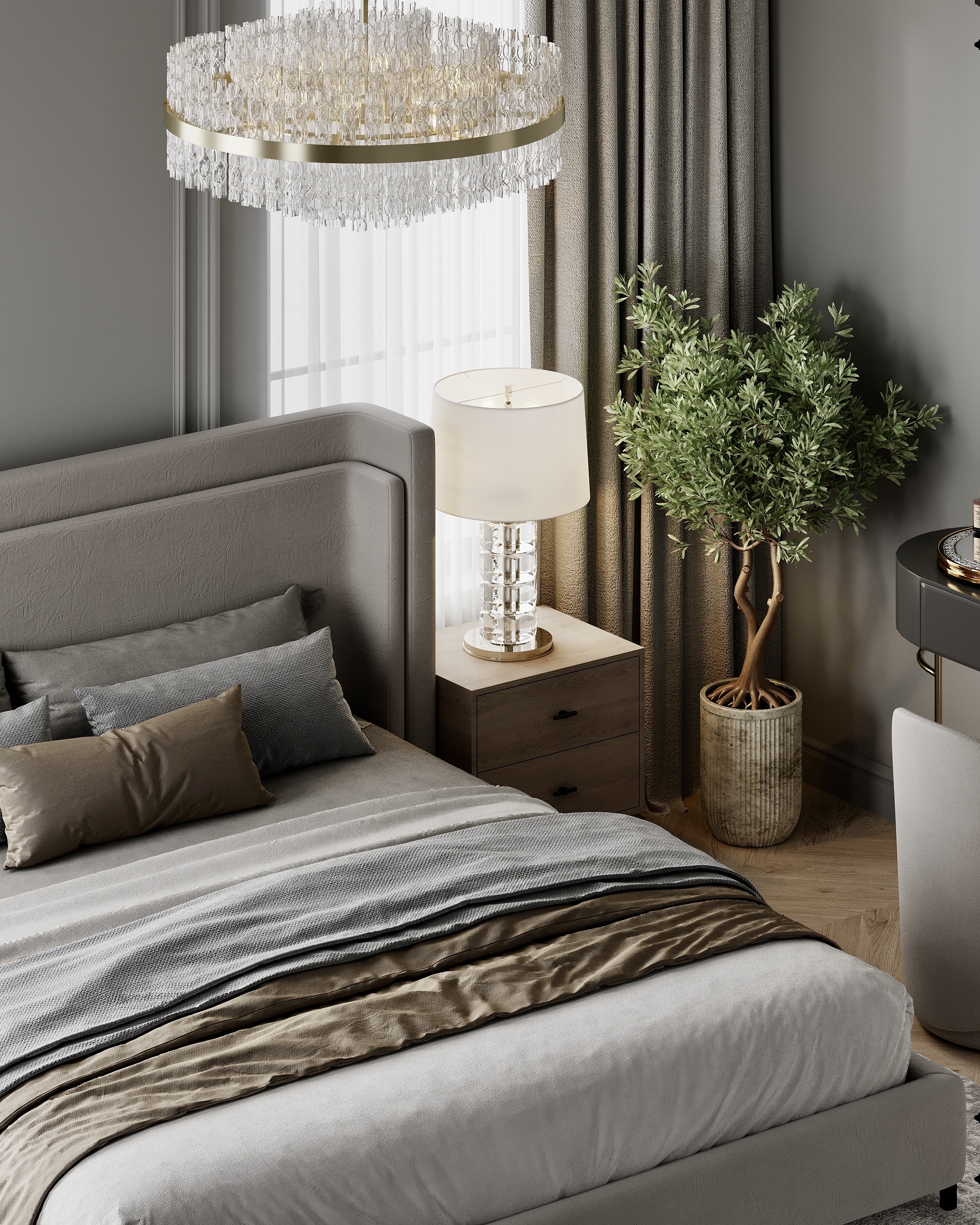 Bedroom with a chandelier above the bed, and an olive tree beside the bedside lamp.