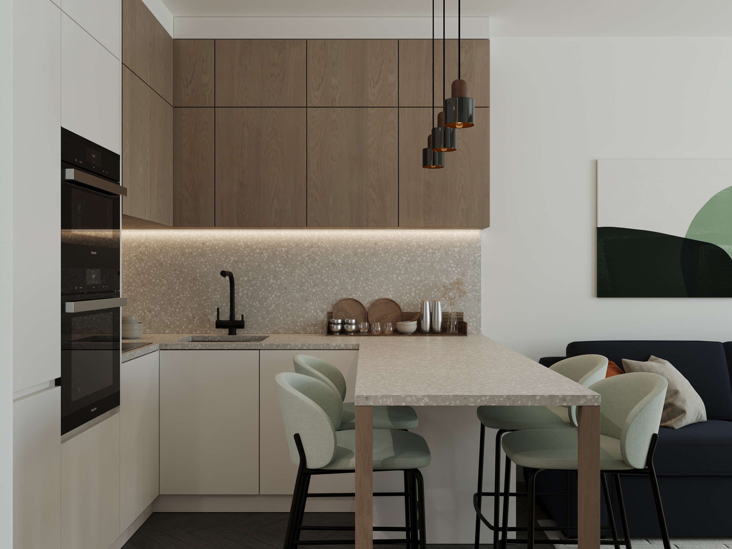 Kitchen with a dining table and green chairs, beside integrated ovens.