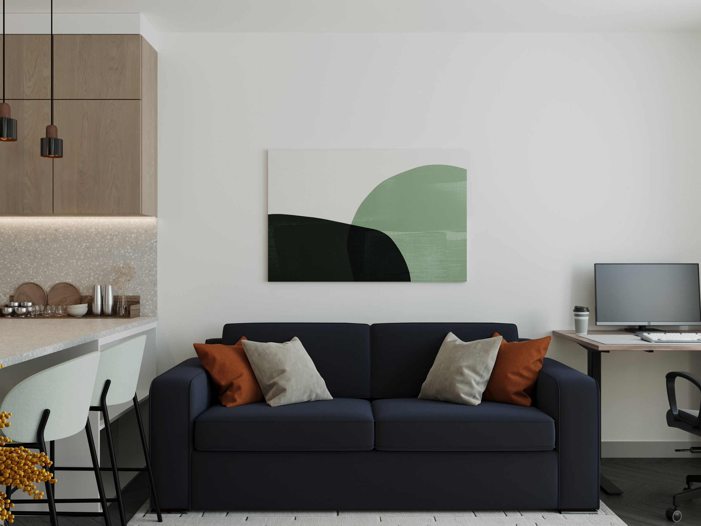 Living area with a navy sofa under a green artwork, and a desk in the corner.