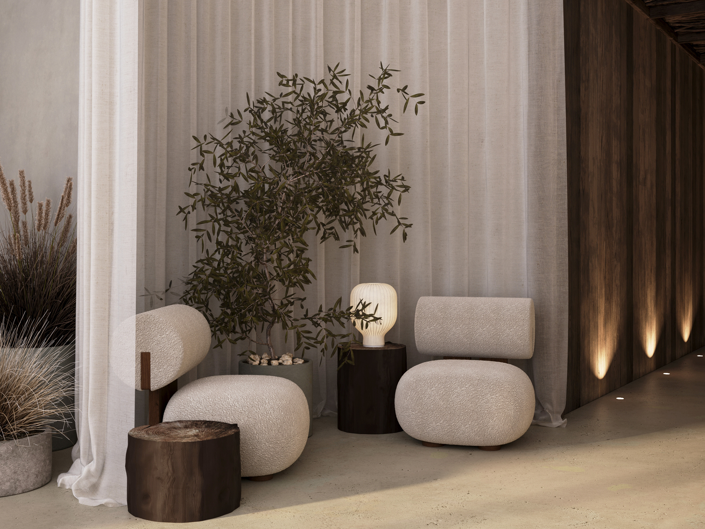 Waiting area with boucle armchairs and an olive tree among tall grasses.